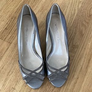 Pewter color heels gently worn.Sparkly and comfort heel.